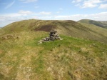 Castlewink summit cairn with Ellson Fell beyond. 